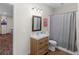Bathroom with rustic vanity, and a shower with a gray curtain at 152 Vinings Lake Ct, Mableton, GA 30126