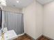 Bathroom featuring a modern vanity, stylish mirror, and a shower with a gray curtain at 152 Vinings Lake Ct, Mableton, GA 30126
