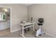 Bedroom featuring a white desk and chair next to a bathroom with a bright double vanity at 152 Vinings Lake Ct, Mableton, GA 30126