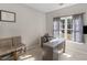 Bedroom with a gray desk, neutral-toned walls, carpeted flooring, and lots of natural light at 152 Vinings Lake Ct, Mableton, GA 30126