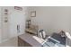Bedroom with desk, carpeted flooring, and a closet with bi-fold doors for extra storage at 152 Vinings Lake Ct, Mableton, GA 30126