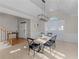 Open dining room adjacent to the entry featuring modern light fixture, and seating for a relaxed gathering at 152 Vinings Lake Ct, Mableton, GA 30126