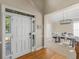 Front door opens to dining room with modern lighting and decor perfect for entertaining and Gathering gatherings at 152 Vinings Lake Ct, Mableton, GA 30126