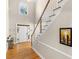 Bright foyer with hardwood floors, staircase, and an arched window providing natural light to greet your guests at 152 Vinings Lake Ct, Mableton, GA 30126