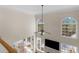 A bright two-story foyer with arched windows and a ceiling fan at 152 Vinings Lake Ct, Mableton, GA 30126