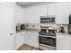 Well-equipped kitchen with stainless steel appliances and plenty of cabinet space, great for cooking and storage at 152 Vinings Lake Ct, Mableton, GA 30126