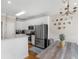 Open kitchen area with stainless steel appliances and dining table at 152 Vinings Lake Ct, Mableton, GA 30126