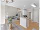 Open-concept living room with hardwood floors and view into the kitchen area at 152 Vinings Lake Ct, Mableton, GA 30126