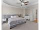 Carpeted main bedroom with upholstered headboard and bedside tables at 152 Vinings Lake Ct, Mableton, GA 30126