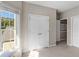 Well lit office space featuring closet space, carpeted floors and a large window at 152 Vinings Lake Ct, Mableton, GA 30126