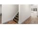 Stairway with wood steps leading to a neutral-toned living space with wood-look floors at 152 Vinings Lake Ct, Mableton, GA 30126