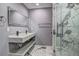 Bathroom with a sleek double vanity, marble accents, and a glass-enclosed shower at 2248 Doris Dr, Decatur, GA 30034
