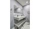 Bathroom with a sleek double vanity, marble accents, and a modern mirror at 2248 Doris Dr, Decatur, GA 30034