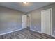 Neutral bedroom showcasing stylish floors, white trim and a double closet door at 2248 Doris Dr, Decatur, GA 30034
