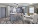 Modern kitchen with gray cabinets, stainless steel appliances, and a dining area at 2248 Doris Dr, Decatur, GA 30034