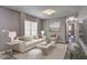 A bright living room showcasing modern decor, including a plush sofa, and a marble coffee table at 2248 Doris Dr, Decatur, GA 30034