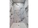 Shower stall with elegant marble tile, a rain shower head, and a built-in niche at 2248 Doris Dr, Decatur, GA 30034