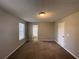 Spacious bedroom with neutral paint, plush carpet, and a window for natural light at 1374 To Lani Farm Rd, Stone Mountain, GA 30083