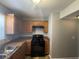 Well-equipped kitchen features modern appliances and ample counter space at 1374 To Lani Farm Rd, Stone Mountain, GA 30083