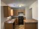 Functional kitchen features wood cabinetry, modern appliances, and efficient layout at 1374 To Lani Farm Rd, Stone Mountain, GA 30083