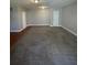 View of the expansive living area, highlighted by neutral paint colors and new carpets at 1374 To Lani Farm Rd, Stone Mountain, GA 30083