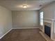 Spacious living room with neutral paint and a fireplace, ready for your personal touch at 1374 To Lani Farm Rd, Stone Mountain, GA 30083