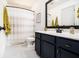 Bathroom with tiled floor, patterned shower curtain, and vanity at 2531 Paul Nw Ave, Atlanta, GA 30318
