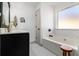 Bathroom featuring tub, white cabinets, and chrome fixtures at 2531 Paul Nw Ave, Atlanta, GA 30318