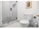 Bathroom featuring a glass enclosed tiled shower and modern toilet at 2531 Paul Nw Ave, Atlanta, GA 30318