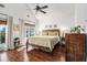 Inviting bedroom featuring wood-look floors, vaulted ceiling, white walls, and natural lighting at 2531 Paul Nw Ave, Atlanta, GA 30318