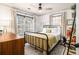 Cozy bedroom with natural light, decorative rug, and wood dresser at 2531 Paul Nw Ave, Atlanta, GA 30318