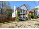 Two-story home featuring double porches, manicured yard, and landscaping at 2531 Paul Nw Ave, Atlanta, GA 30318