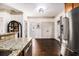 Well lit kitchen with stainless steel appliances, granite countertops, and access to next room at 2531 Paul Nw Ave, Atlanta, GA 30318