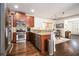 Well-lit kitchen with stainless steel appliances, wood cabinets, and granite countertops at 2531 Paul Nw Ave, Atlanta, GA 30318