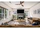 Spacious living room with a cozy fireplace, large windows, and comfortable seating at 2531 Paul Nw Ave, Atlanta, GA 30318