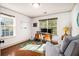 Comfortable home office featuring hardwood floors, a large window, and a cozy sitting area at 2531 Paul Nw Ave, Atlanta, GA 30318