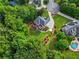 Aerial view of a brick home with mature trees and a large lawn at 2930 Monticello Dr, Cumming, GA 30041