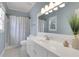 Bathroom featuring blue walls, white cabinets and tile flooring at 2930 Monticello Dr, Cumming, GA 30041