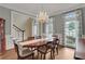 Elegant dining room featuring a chandelier, large windows, and classic architectural details at 2930 Monticello Dr, Cumming, GA 30041