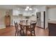 Bright eat-in kitchen with stainless steel appliances, wooden table, and white cabinets at 2930 Monticello Dr, Cumming, GA 30041