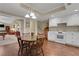 Cozy eat-in kitchen with stainless appliances, white cabinets, and a four-chair wooden table at 2930 Monticello Dr, Cumming, GA 30041