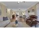 Spacious living room featuring hardwood floors, fireplace, and view into kitchen at 2930 Monticello Dr, Cumming, GA 30041