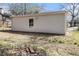Side view of backyard showcasing the level lot with minimal foliage, suitable for various activities at 3197 Church St, Atlanta, GA 30344