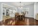 Open dining area featuring hardwood floors, natural light, and a seamless transition to the kitchen at 3197 Church St, Atlanta, GA 30344