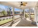 Spacious porch featuring wooden floors, ceiling fan, and a view of the neighborhood street at 3197 Church St, Atlanta, GA 30344