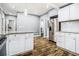 Updated kitchen with stainless steel appliances, white cabinets, and stone countertops at 3197 Church St, Atlanta, GA 30344