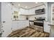 Corner kitchen with stainless steel appliances, ample counter space, and bright white cabinets at 3197 Church St, Atlanta, GA 30344