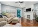 Stylish living room with hardwood floors, comfortable seating, fireplace, and a vibrant blue door at 3197 Church St, Atlanta, GA 30344
