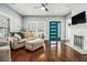 Comfortable living room with hardwood floors, large windows, and a cozy fireplace at 3197 Church St, Atlanta, GA 30344