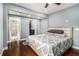 Neutral bedroom with hardwood floors, ensuite bath and walk in closet at 3197 Church St, Atlanta, GA 30344